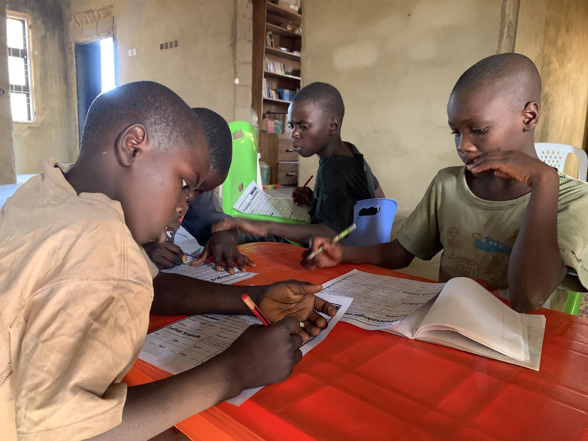 Two boys reading together in a COAL-supported class