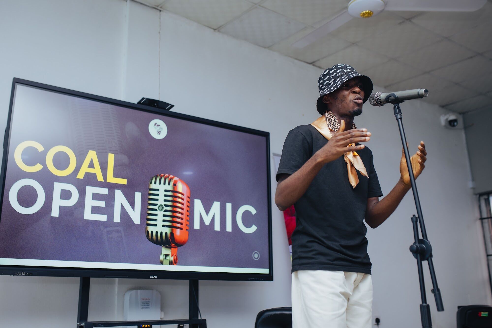 A performer on the COAL Open Mic stage